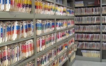 Room full of medical files on shelves