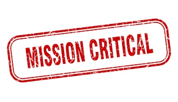 A red vintage stamp that reads "Mission Critical"