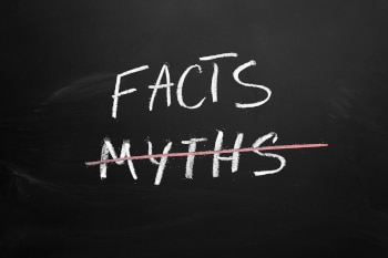 A blackboard with the words "Facts" and "Myths" written on it. The word Myths is crossed out.