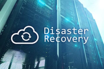 The words "Disaster Recovery" with a Cloud Icon and a computer motherboard with a blue glow in the background