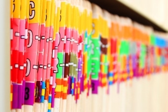 Medical files on a shelf
