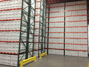 Warehouse shelves full of file cardboard boxes.