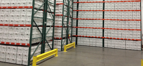 Warehouse shelves full of file cardboard boxes.