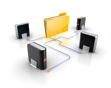 A digital illustration of a file folder connected to four different computer hard drives