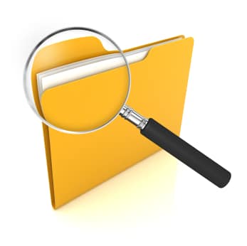 An illustration of a file folder with a magnifying glass looking at the top corner